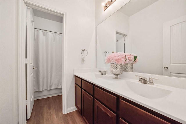 bathroom with vanity and hardwood / wood-style floors