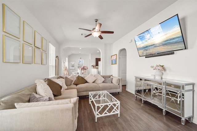 living room featuring dark hardwood / wood-style floors and ceiling fan