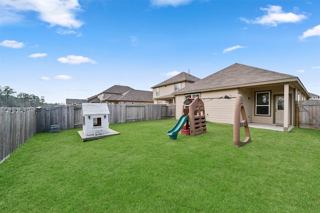 view of yard with a patio area and a playground