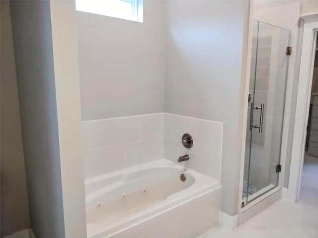 full bath with a whirlpool tub and a stall shower