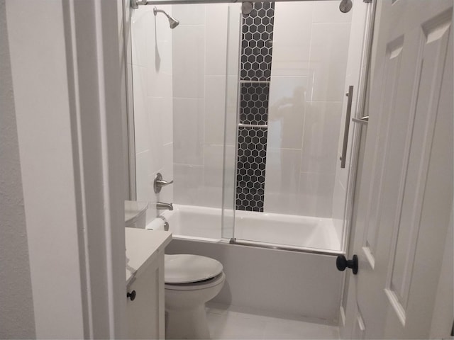 full bathroom with enclosed tub / shower combo, vanity, and toilet