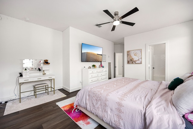 bedroom featuring ceiling fan, dark wood-type flooring, visible vents, and baseboards