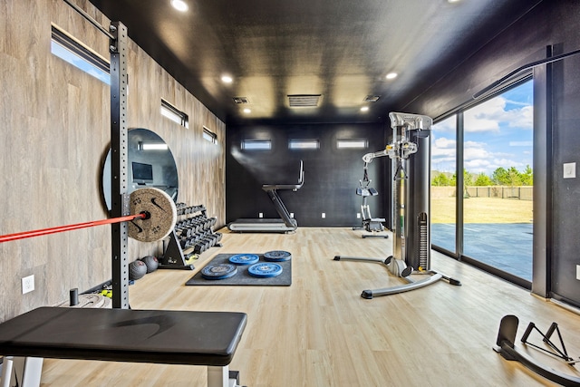 interior space with wood finished floors and visible vents