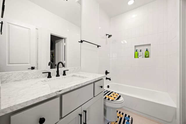 full bathroom with toilet, tile patterned flooring, vanity, and shower / bathing tub combination