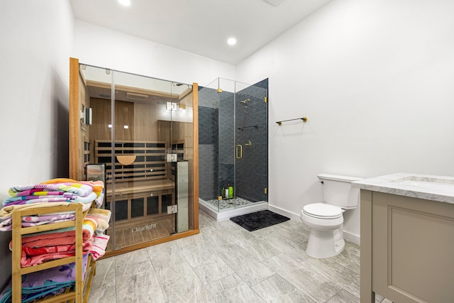 full bathroom with toilet, recessed lighting, vanity, baseboards, and a stall shower