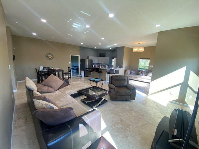 living room with a notable chandelier