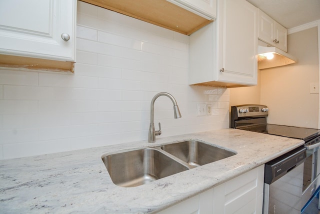 kitchen with light stone countertops, appliances with stainless steel finishes, sink, and white cabinets