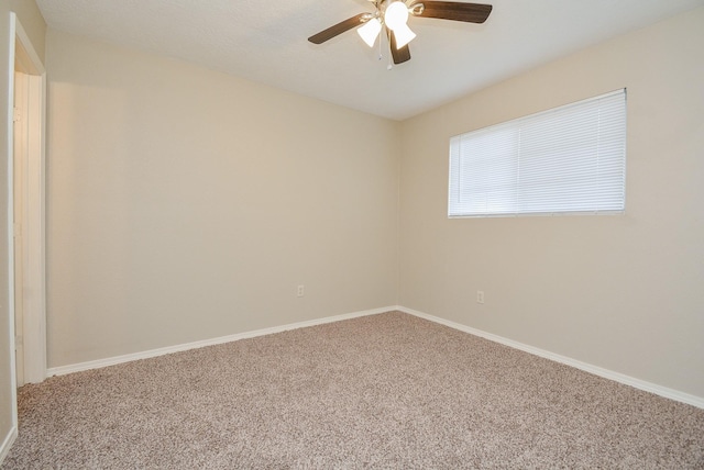 carpeted empty room with ceiling fan