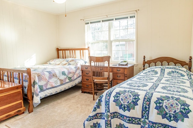 carpeted bedroom featuring crown molding