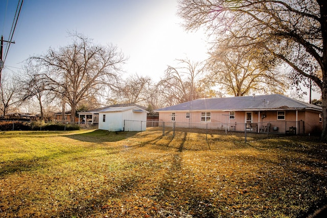 rear view of property featuring a yard