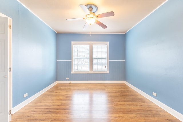 unfurnished room featuring crown molding, ceiling fan, and light hardwood / wood-style floors