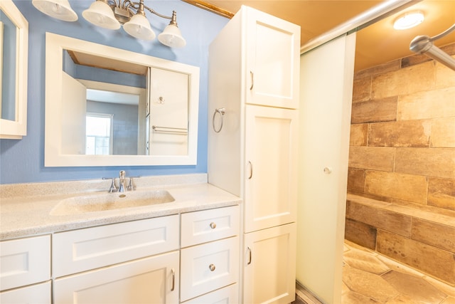 bathroom featuring vanity and a shower with shower door