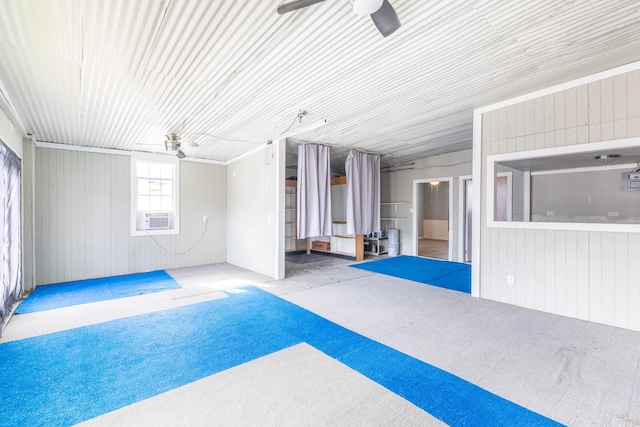 interior space with cooling unit and ceiling fan