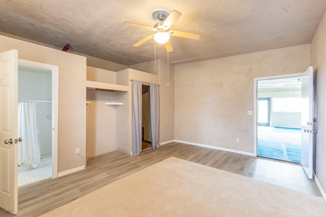 unfurnished bedroom featuring ceiling fan and light hardwood / wood-style flooring