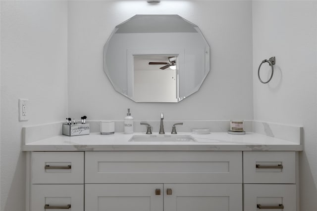 bathroom featuring ceiling fan and vanity