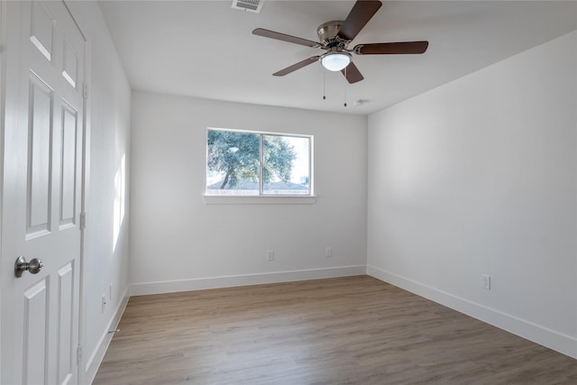 spare room featuring ceiling fan and light hardwood / wood-style floors