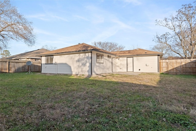 rear view of house with a lawn