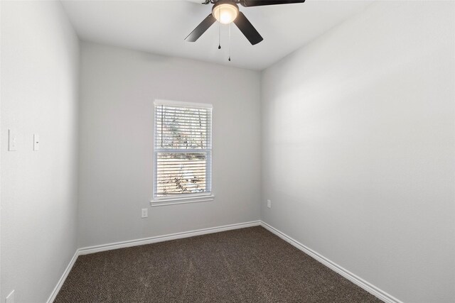 spare room with carpet floors and ceiling fan