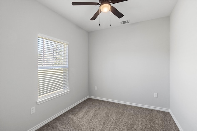 spare room featuring carpet and ceiling fan