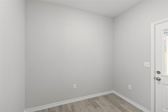 spare room featuring light wood-type flooring