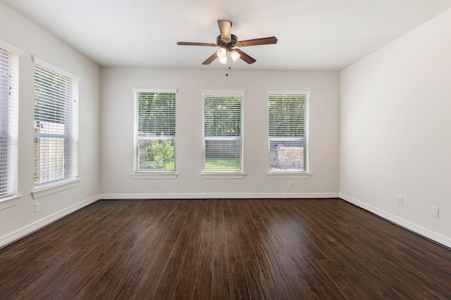 unfurnished room featuring ceiling fan and dark hardwood / wood-style flooring