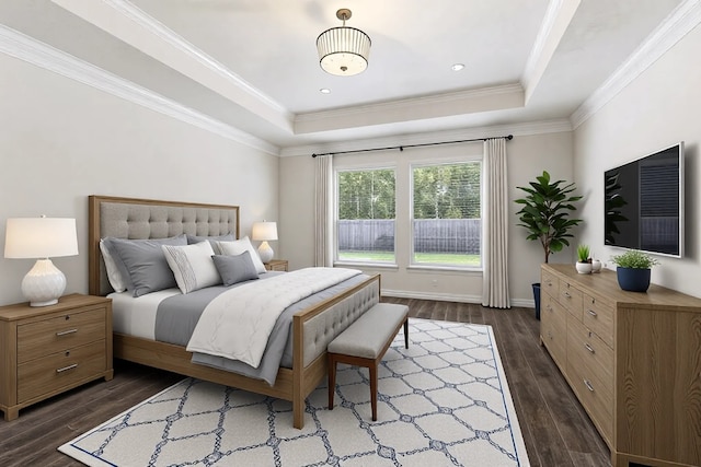 bedroom featuring a raised ceiling, ornamental molding, and dark wood-type flooring