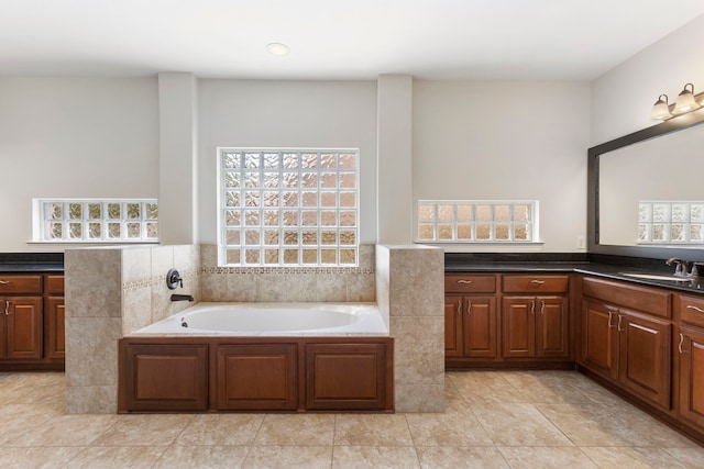 bathroom featuring vanity and a tub