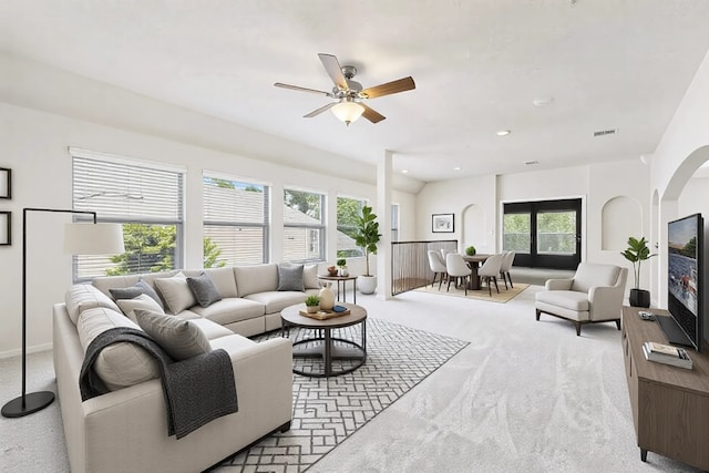 living room with light carpet and ceiling fan