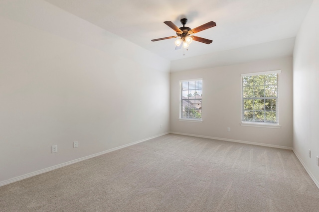 unfurnished room featuring ceiling fan and light carpet