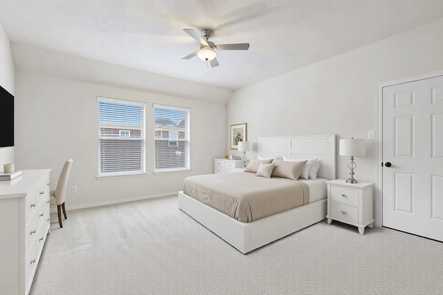 carpeted bedroom with lofted ceiling and ceiling fan