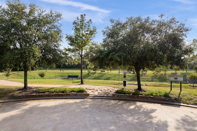 view of home's community featuring a lawn