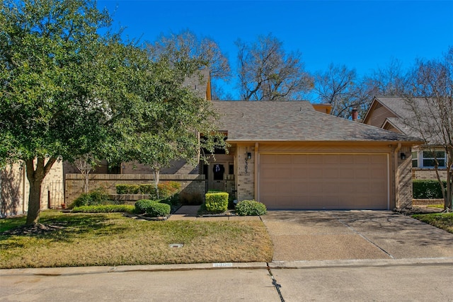 view of front of home with a garage and a front yard