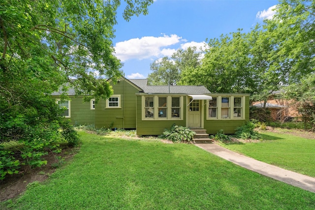 2506 Brazeal St, Waller, TX 77484 - view of front facade featuring a front lawn, a shingled roof, and entry steps