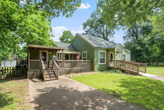 2506 Brazeal St, Waller, TX 77484 - single story home featuring covered porch, roof with shingles, fence, a deck, and a front yard