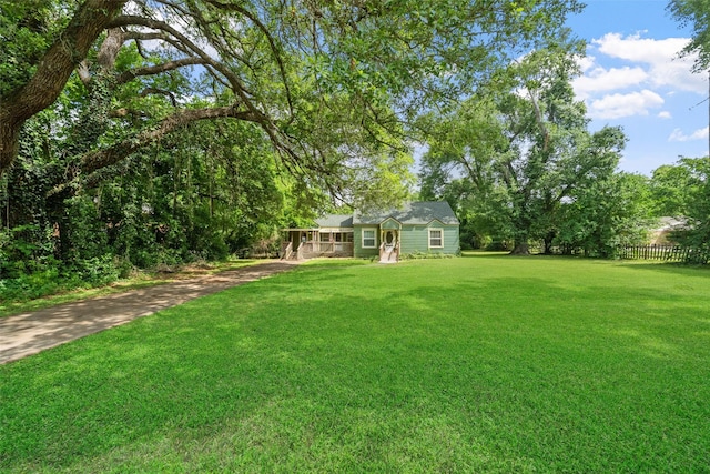 2506 Brazeal St, Waller, TX 77484 - view of yard featuring driveway and fence