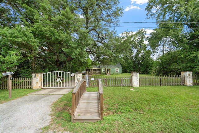 2506 Brazeal St, Waller, TX 77484 - view of yard with a fenced front yard and a gate