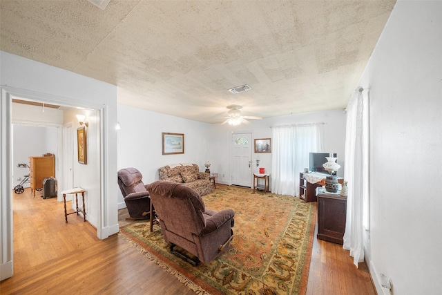 2506 Brazeal St, Waller, TX 77484 - living room with a ceiling fan, attic access, visible vents, and wood finished floors