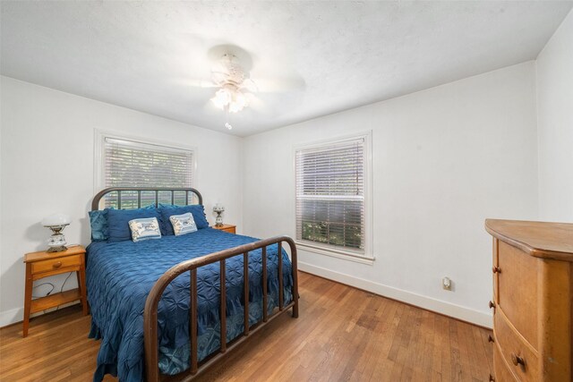 2506 Brazeal St, Waller, TX 77484 - bedroom with ceiling fan, baseboards, and wood finished floors
