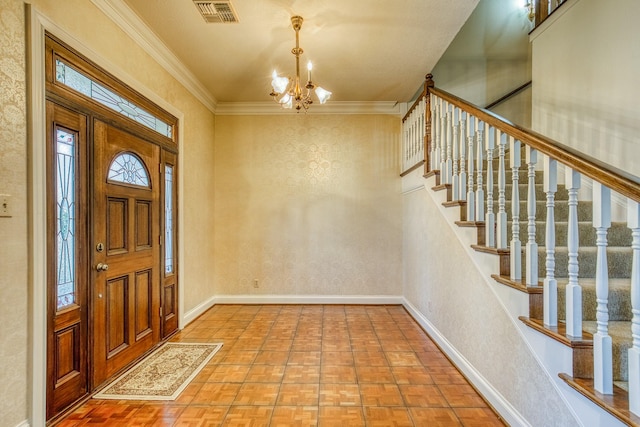 foyer entrance featuring light parquet floors, crown molding, and a chandelier