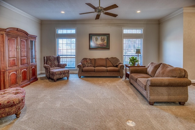 living room featuring crown molding, ceiling fan, and light carpet