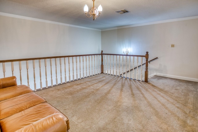 unfurnished room with a notable chandelier, crown molding, a textured ceiling, and carpet flooring