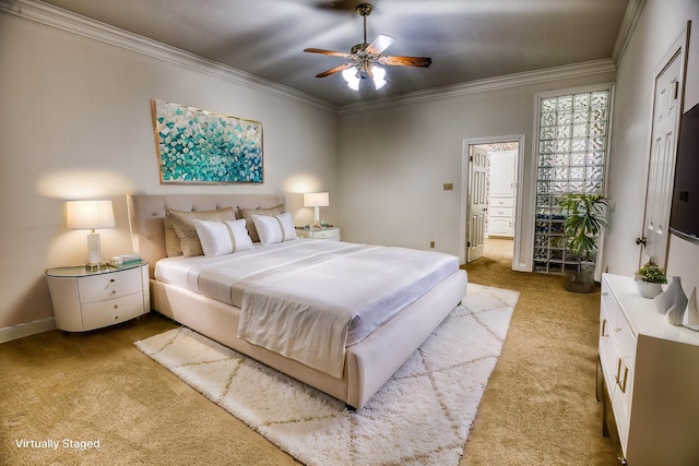 bedroom featuring crown molding, ceiling fan, and connected bathroom