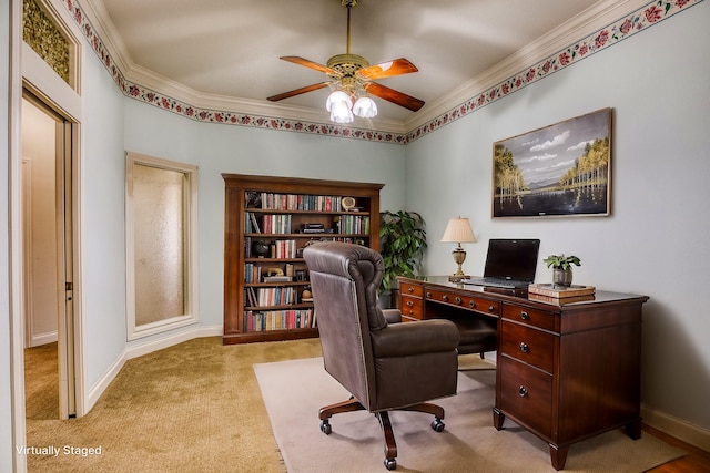 carpeted home office with ornamental molding and ceiling fan