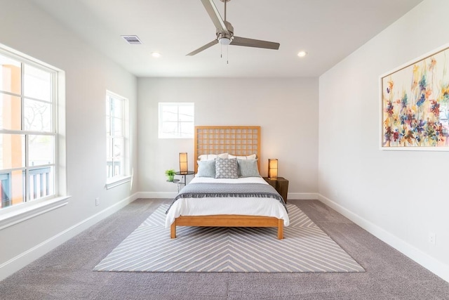 carpeted bedroom with ceiling fan