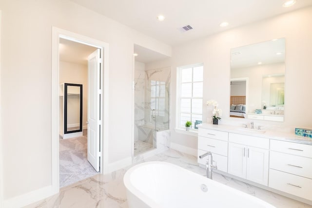 bathroom with vanity and separate shower and tub