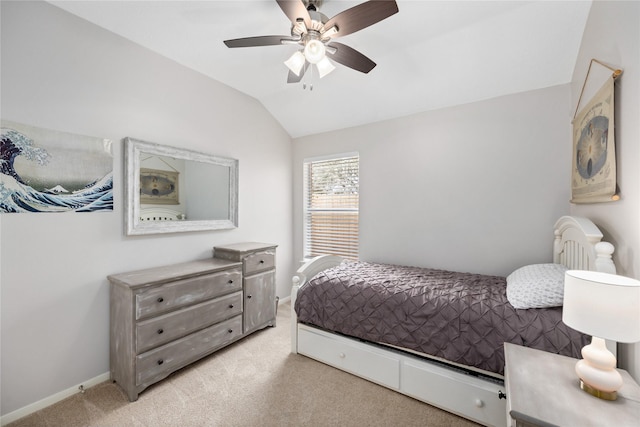 bedroom with lofted ceiling, light carpet, and ceiling fan