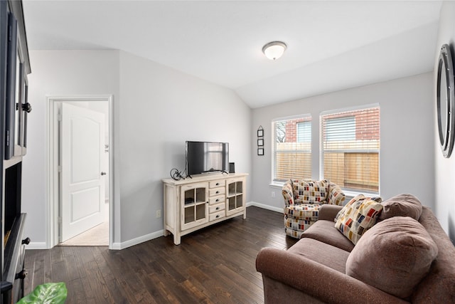 living room with dark hardwood / wood-style flooring and vaulted ceiling