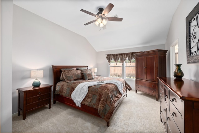 bedroom with lofted ceiling, light carpet, and ceiling fan