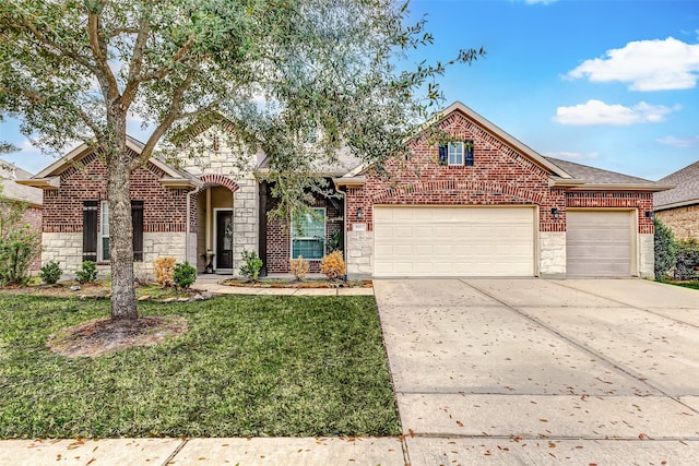 view of front property featuring a garage and a front yard