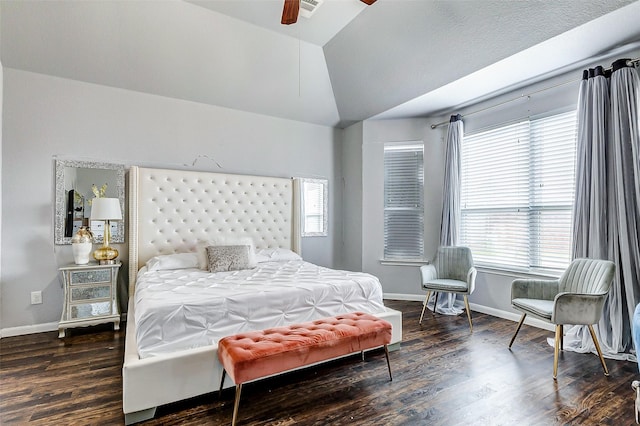 bedroom with dark wood-type flooring, ceiling fan, and lofted ceiling